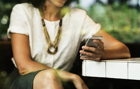 Woman using her iPhone